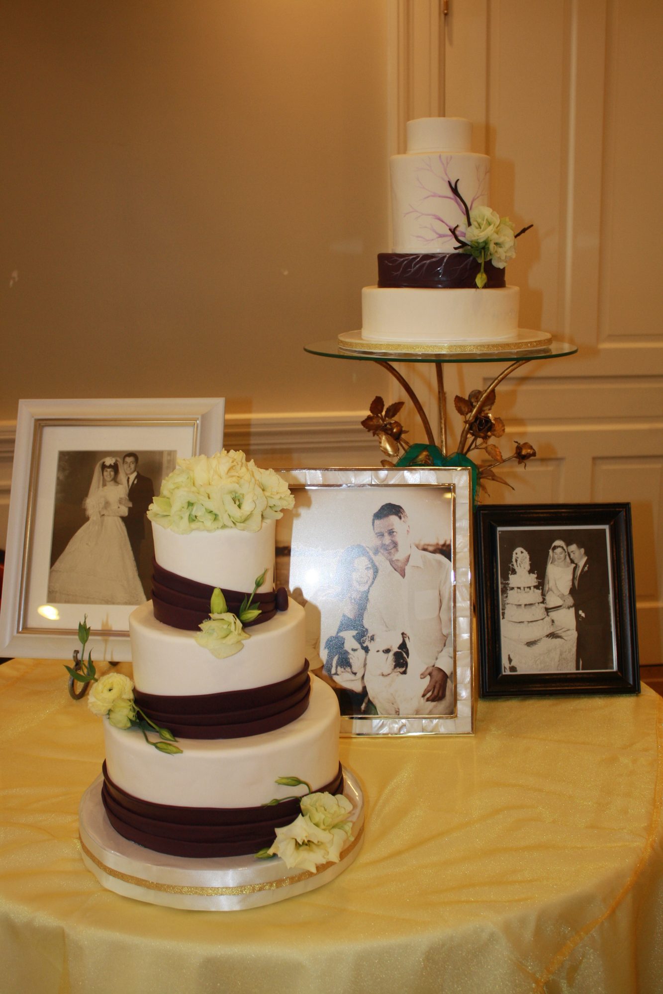 Wedding cake with eggplant ribbon accents